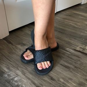 Black Nike slides